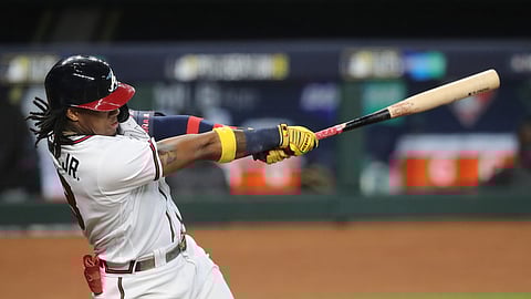 Atlanta Braves' Ronald Acuna hits a solo homer off Miami Marlins starting pitcher Sandy Alcantara during the first inning of Game 1 of a baseball NL Division Series on Tuesday, Oct. 6, 2020, in Houston.