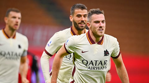 Roma's Jordan Veretout celebrates after scoring during the Serie A soccer match between AC Milan and Roma at the Milan San Siro Stadium, Italy, Monday, Oct. 26, 2020.
