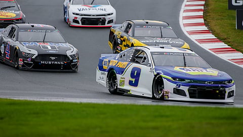 Chase Elliott leads the way out of turn 7 as he competes in a NASCAR Cup Series auto race at Charlotte Motor Speedway in Concord, N.C., Sunday, Oct. 11, 2020. Elliott won the race.