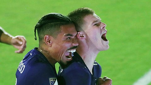 Orlando City's Chris Mueller, right, and Junior Urso scream in celebration after Mueller scored a goal against the Columbus Crew during an MLS soccer match in Orlando, Fla., Wednesday, Nov. 4, 2020. Orlando won 2-1.