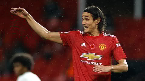 Manchester United's Edinson Cavani gives instructions during the English Premier League soccer match between Manchester United and Arsenal at the Old Trafford stadium in Manchester, England, Sunday, Nov. 1, 2020.