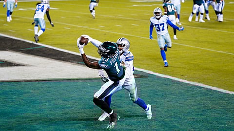 Philadelphia Eagles' Travis Fulgham (13) catches a touchdown pass against Dallas Cowboys' Trevon Diggs (27) during the second half of an NFL football game, Sunday, Nov. 1, 2020, in Philadelphia.