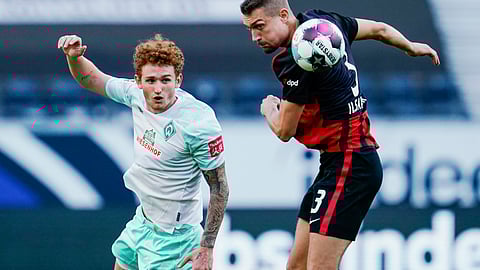 Bremen's Josh Sargent, left, and Frankfurt's Stefan Ilsanker fight for the ball during the German Bundesliga soccer match between Eintracht Frankfurt and Werder Bremen in Frankfurt, Germany, Saturday, Oct. 31, 2020.