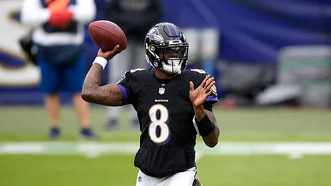 Baltimore Ravens quarterback Lamar Jackson throws a pass against the Tennessee Titans during the first half of an NFL football game, Sunday, Nov. 22, 2020, in Baltimore.