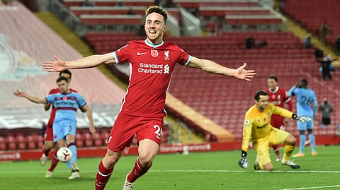 Liverpool's Diogo Jota celebrates after he scores his sides second goal during the English Premier League soccer match between Liverpool and West Ham United at Anfield stadium in Liverpool, England, Saturday, Oct. 31, 2020.