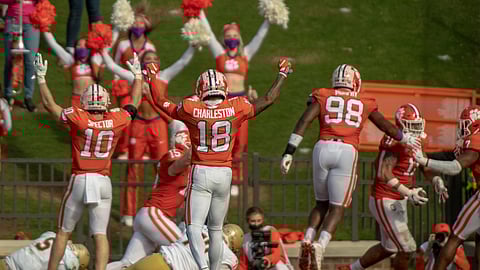 Clemson linebacker Baylon Spector(10), safety Joseph Charleston(18), and defensive end Myles Murphy(98) join in celebrating a safety during the second half of an NCAA college football game against Boston College Saturday, Oct. 31, 2020, in Clemson, S.C.