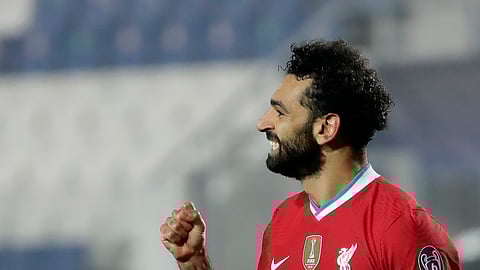 FILE - Liverpool's Mohamed Salah celebrates his goal against Atalanta during the Champions League, group D soccer match between Atalanta and Liverpool, at the Gewiss Stadium in Bergamo, Italy, Sean Miller likes him to score today against Brighton.