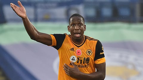 Wolverhampton Wanderers' Willy Boly reacts during the English Premier League soccer match between Leicester City and Wolverhampton Wanderers at the King Power Stadium in Leicester, England, Sunday, Nov. 8, 2020.