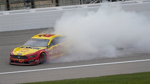 Joey Logano celebrates after winning a NASCAR Cup Series auto race at Kansas Speedway in Kansas City, Kan., Sunday, Oct. 18, 2020. Logano is picked by 2 of "The Eckel 4" to win the NASCAR Cup.