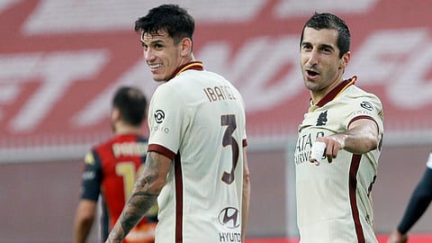 Roma's Henrikh Mkhitaryan, right, celebrates after scoring during the Serie A soccer match between Genoa and Roma, at the Luigi Ferraris Stadium in Genoa, Italy, Sunday, Nov. 8, 2020.