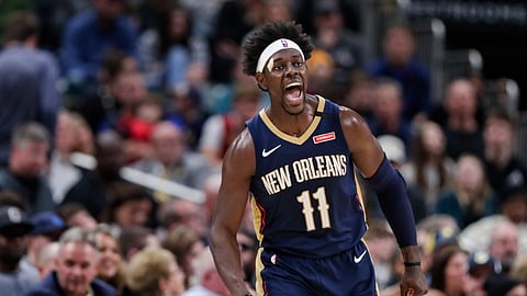 In this Feb. 8, 2020, file photo, New Orleans Pelicans guard Jrue Holiday celebrates a 3-point basket late in the second half of the team's NBA basketball game against the Indiana Pacers in Indianapolis. Jrue Holiday is being traded from New Orleans to Milwaukee, which is aiming to give two-time reigning NBA MVP Giannis Antetokounmpo the improved roster that he seeks with the decision on his supermax contract extension looming.