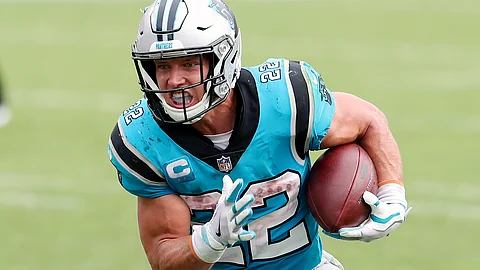 Carolina Panthers running back Christian McCaffrey (22) rushes for a touchdown against the Tampa Bay Buccaneers during the second half of an NFL football game Sunday, Sept. 20, 2020, in Tampa, Fla. The Panthers are eager to get Christian McCaffrey back on the field after he has missed four games with a high ankle sprain.