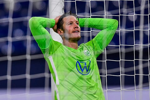 FILE - In this Saturday, Nov. 21, 2020 file photo, Wolfsburg's Wout Weghorst reacts during the German Bundesliga soccer match between VfL Wolfsburg and FC Schalke 04 at the Veltins-Arena in Gelsenkirchen, Germany.