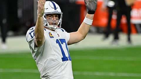 Indianapolis Colts quarterback Philip Rivers (17) celebrates after running back Jonathan Taylor scored a touchdown against the Las Vegas Raiders during the second half of an NFL football game, Sunday, Dec. 13, 2020, in Las Vegas.