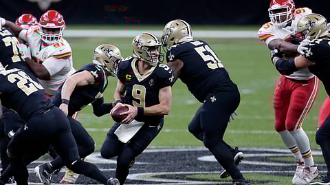 New Orleans Saints quarterback Drew Brees (9) drops back in the first half of an NFL football game against the Kansas City Chiefs in New Orleans, Sunday, Dec. 20, 2020.