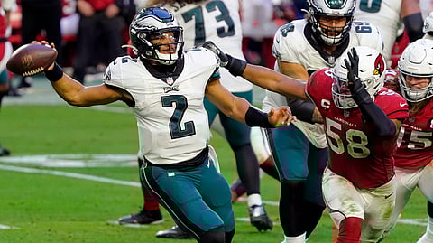 Philadelphia Eagles quarterback Jalen Hurts (2) throws under pressure from Arizona Cardinals middle linebacker Jordan Hicks (58) during the second half of an NFL football game, Sunday, Dec. 20, 2020, in Glendale, Ariz.