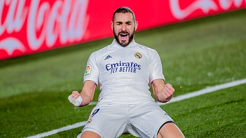 Real Madrid's Karim Benzema celebrates after scoring his side's second goal during the Spanish La Liga soccer match between Real Madrid and Athletic Club Bilbao at the Alfredo Di Stefano stadium in Madrid, Spain, Tuesday, Dec. 15, 2020.