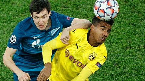 Zenit's Vyacheslav Karavaev, left, and Dortmund's Ansgar Knauff during the Champions League group F soccer match between Zenit St.Petersburg and Borussia Dortmund at the Saint Petersburg stadium in St. Petersburg, Russia, Tuesday, Dec. 8, 2020.