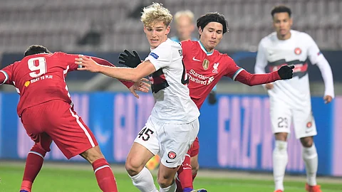 FC Midtjylland's Gustav Isaksen (45), center, breaks away from Liverpool during their Champions League Group D soccer match at MCH Arena in Herning, Denmark, Wednesday Dec. 9, 2020.