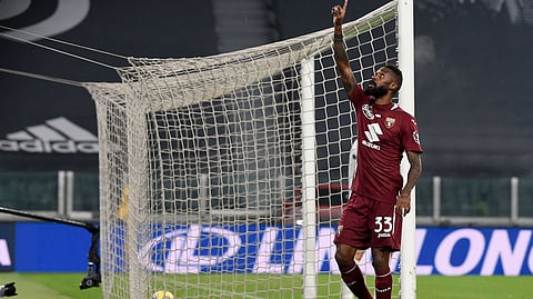 Torino's Nicolas Nkoulou celebrates after scoring during the Serie A soccer match between Juventus and Torino at the Allianz Stadium in Turin, Italy, Saturday, Dec. 5, 2020.