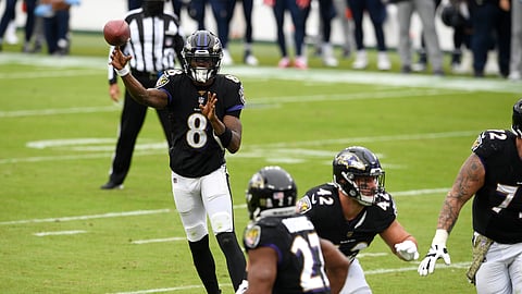 Baltimore Ravens quarterback Lamar Jackson (8) throws a pass to running back J.K. Dobbins (27) on a 2-point conversion play against the Tennessee Titans during the first half of an NFL football game, Sunday, Nov. 22, 2020, in Baltimore.