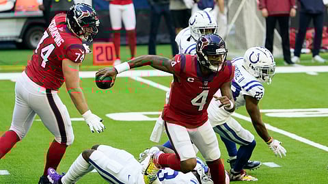 Houston Texans quarterback Deshaun Watson (4) escapes the grasp of Indianapolis Colts outside linebacker Darius Leonard (53) during the first half of an NFL football game Sunday, Dec. 6, 2020, in Houston.