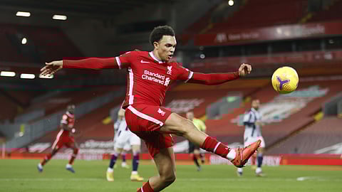Liverpool's Trent Alexander-Arnold kicks the ball during an English Premier League soccer match between Liverpool and West Bromwich Albion at the Anfield stadium in Liverpool, England, Sunday Dec. 27, 2020.