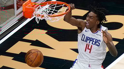 Los Angeles Clippers guard Terance Mann (14) scores against the Atlanta Hawks in the second half of an NBA basketball game Tuesday, Jan. 26, 2021, in Atlanta.