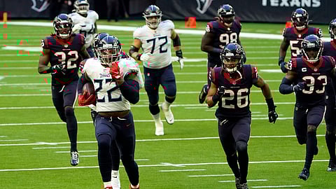 Tennessee Titans running back Derrick Henry (22) runs for a touchdown as Houston Texans defense chase him during the first half of an NFL football game Sunday, Jan. 3, 2021, in Houston.