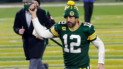 Green Bay Packers quarterback Aaron Rodgers pumps his fist after an NFL divisional playoff football game against the Los Angeles Rams Saturday, Jan. 16, 2021, in Green Bay, Wis. The Packers defeated the Rams 32-18 to advance to the NFC championship game.