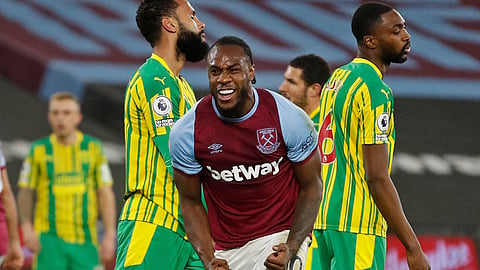 West Ham's Michail Antonio, centre, celebrates after scoring his side's second goal during an English Premier League soccer match between West Ham and West Bromwich Albion at the London Stadium in London, England, Tuesday Jan.19, 2021.