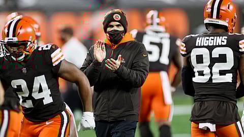 Cleveland Browns head coach Kevin Stefanski keeps watch before an NFL football game against the Baltimore Ravens, Monday, Dec. 14, 2020, in Cleveland. After days of positive COVID-19 tests, disruptions and delays, the Browns found some normalcy and got to re-open their facility on Friday, Jan. 1, 2021, to resume getting ready to play the Pittsburgh Steelers and possibly end a postseason drought stretching back to 2002.