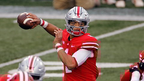Ohio State quarterback Justin Fields throws a pass against Indiana during the first half of an NCAA college football game in Columbus, Ohio, in this Saturday, Nov. 21, 2020, file photo. Fields threw a Sugar Bowl-record six touchdown passes and accumulated 385 yards passing in the third-ranked Buckeyes’ 49-28 College Football Playoff semifinal victory over No. 2 Clemson.