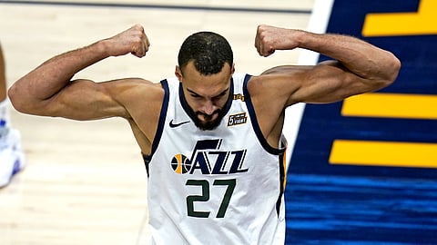 Utah Jazz center Rudy Gobert flexes his muscles after scoring against Los Angeles Clippers Nicolas Batum during the second half of an NBA basketball game Friday, Jan. 1, 2021, in Salt Lake City.
