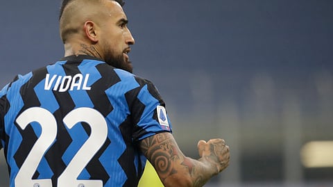 Inter Milan's Arturo Vidal celebrates after scoring his side's opening goal during a Serie A soccer match between Inter Milan and Juventus at the San Siro stadium in Milan, Italy, Sunday, Jan. 17, 2021.