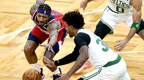 Boston Celtics guard Marcus Smart (36) steals the ball from Washington Wizards guard Bradley Beal (3) during the first quarter of an NBA basketball game Friday, Jan. 8, 2021, in Boston.