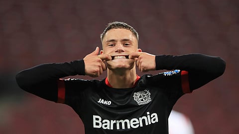 Leverkusen's Florian Wirtz celebrates his goal to make it 4:0 during the German Bundesliga soccer match between 1. FC Cologne and Bayer Leverkusen at the RheinEnergieStadion in Cologne, Germany, Wednesday, Dec. 16, 2020.