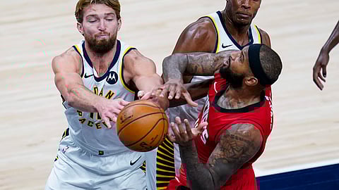 Houston Rockets center DeMarcus Cousins (15) and Indiana Pacers forward Domantas Sabonis (11) fight for a rebound during the third quarter of an NBA basketball game in Indianapolis, Wednesday, Jan. 6, 2021.