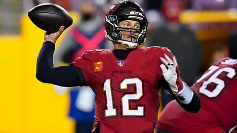 Tampa Bay Buccaneers quarterback Tom Brady (12) throws a pass during the second half of an NFL wild-card playoff football game against the Washington Football Team, Saturday, Jan. 9, 2021, in Landover, Md.