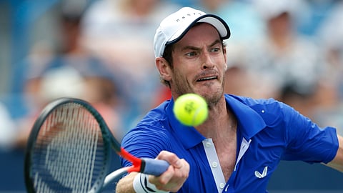 In this Monday, Aug. 12, 2019 file photo Andy Murray, of Britain, hits a forehand against Richard Gasquet, of France, during first-round play at the Western & Southern Open tennis tournament, in Mason, Ohio. Former world number one Murray's participation at the upcoming Australian Open is in doubt after the Briton tested positive for COVID-19.