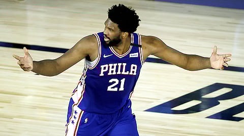 Philadelphia 76ers' Joel Embiid reacts after a basket during the third quarter of an NBA basketball game against the Orlando Magic, Friday, Aug. 7, 2020, in Lake Buena Vista, Fla.
