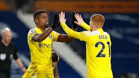Fulham's Ivan Cavaleiro, left, celebrates with Fulham's Harrison Reed after he scores his team's second goal during the English Premier League soccer match between West Bromwich Albion and Fulham at the Hawthorns stadium in West Bromwich, England, Saturday, Jan.30, 2021.