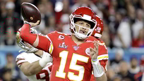 In this Feb. 2, 2020, file photo, Kansas City Chiefs quarterback Patrick Mahomes (15) passes against the San Francisco 49ers during the first half of the NFL Super Bowl 54 football game in Miami Gardens, Fla.