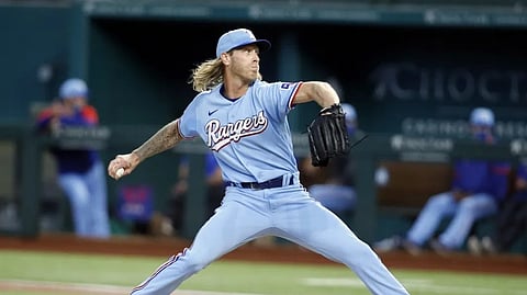 Mike Foltynewicz, hair flowing in the wind, now pitches for the Texas Rangers