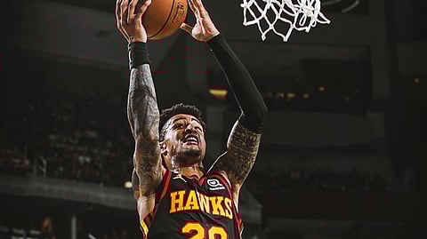 Going up for a dunk or grabbing a board? Today, Fats hopes John Collins is grabbing boards.