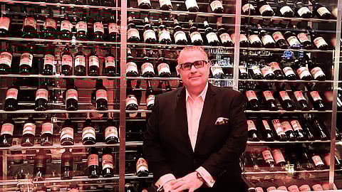 Salvatore Spena, general manager of Vic & Anthony's Steakhouse at Golden Nugget Atlantic City, in front of part of the restaurant's extensive wine inventory.
