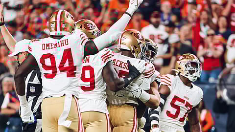 The 49ers celebrate a sack.
