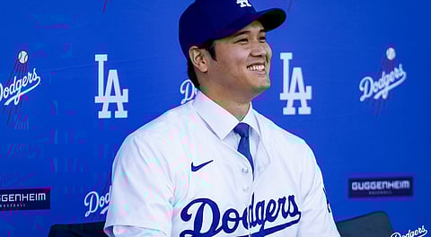 Shohei Otani has 700 million reasons to smile at his first press conference as a Los Angeles Dodger.