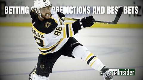 David Pastrnak takes a shot for the Boston Bruins.