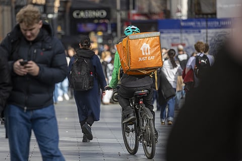 A food delivery courier for Just Eat Takeaway in London.